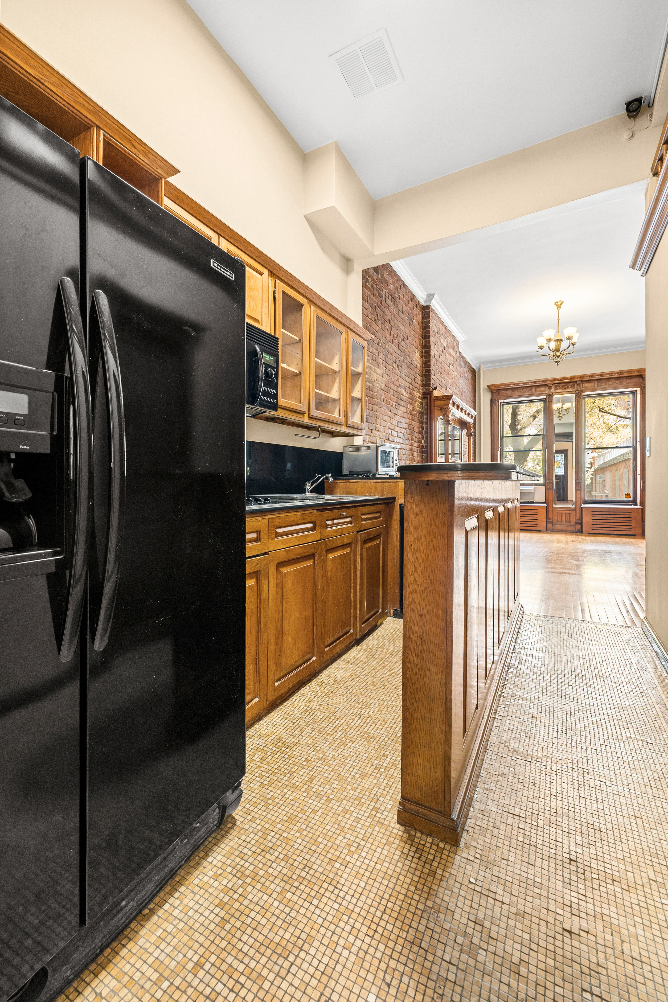 154 West 77th Street, Unit #1 Manhattan, NY 10024 - Photo 4 of 10 a kitchen with stainless steel appliances granite countertop a refrigerator a stove and a sink