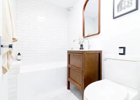 a bathroom with a sink a toilet and bathtub