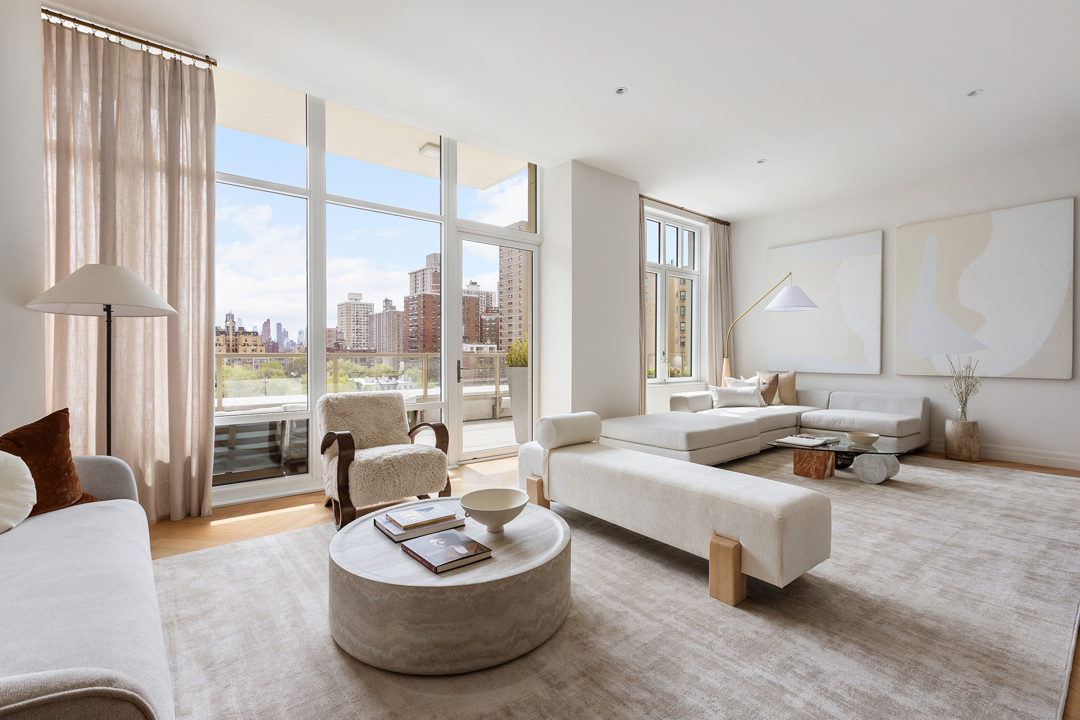 15 West 96th Street, Unit 11 Manhattan, NY 10025 - Photo 2 of 19 a living room with furniture and a large window