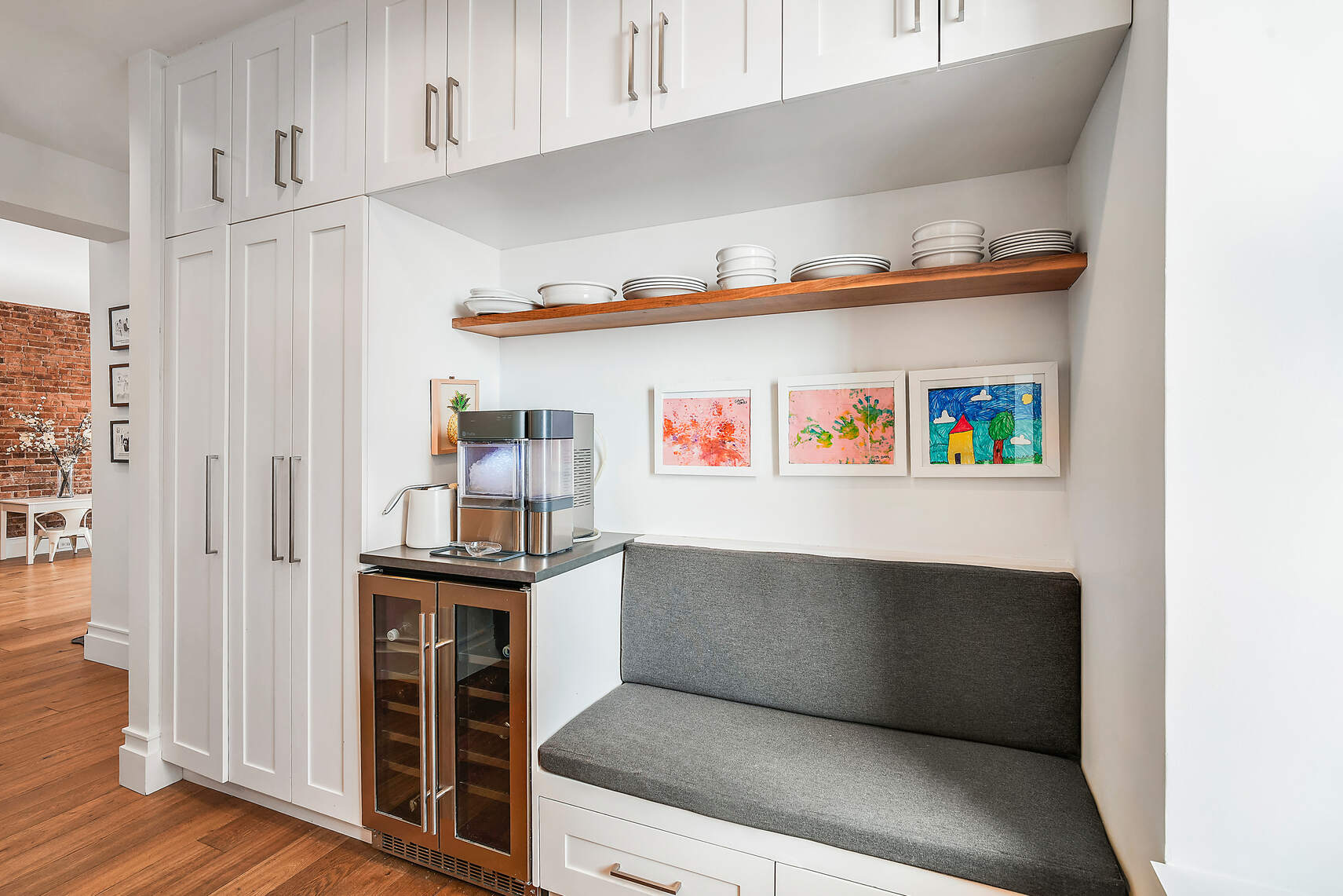 60 Pineapple Street, Unit 7I Brooklyn, NY 11201 - Photo 6 of 14 a kitchen with cabinets and wooden floor