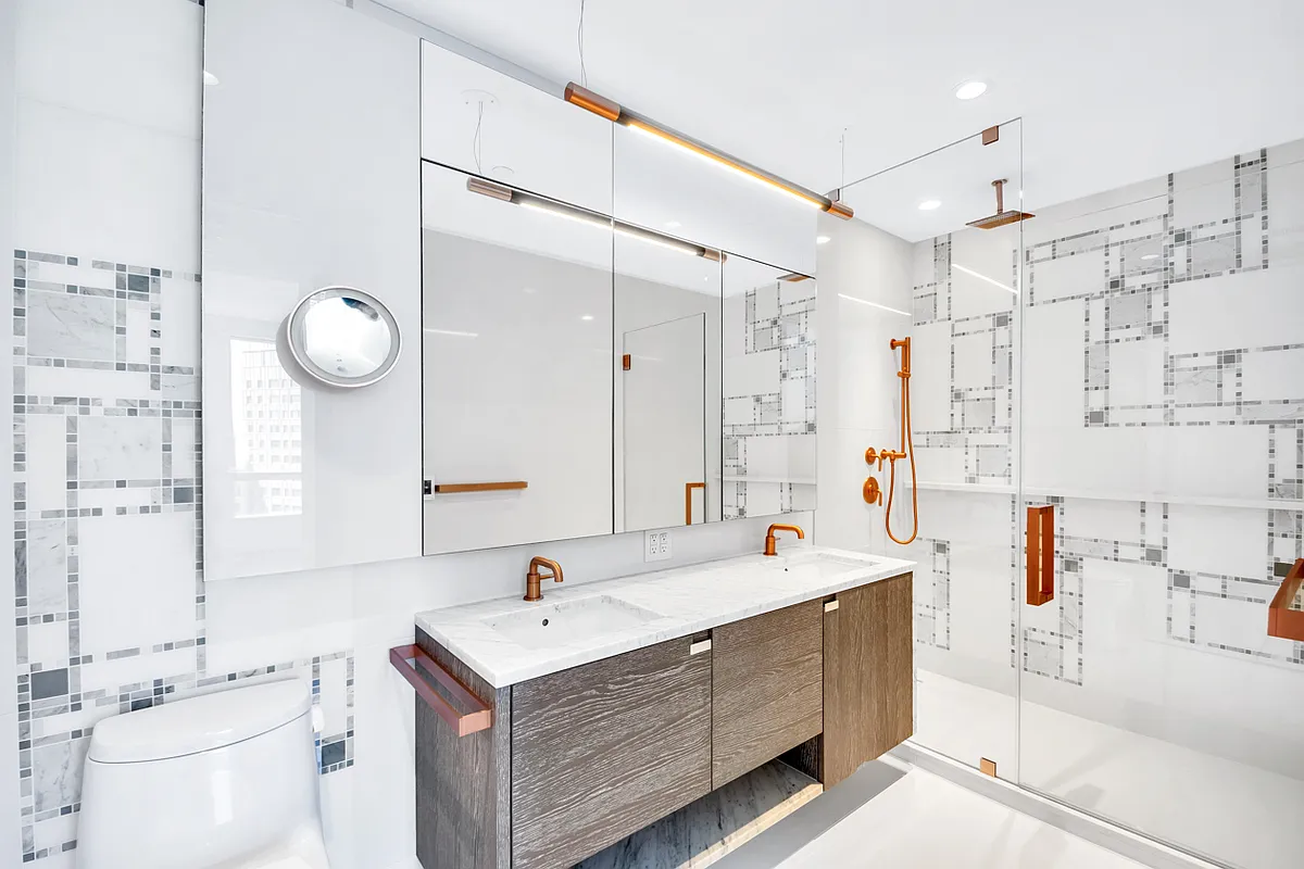 1 City Point, Unit 25L Brooklyn, NY 11201 - Photo 7 of 25 a bathroom with a double vanity sink mirror and shower