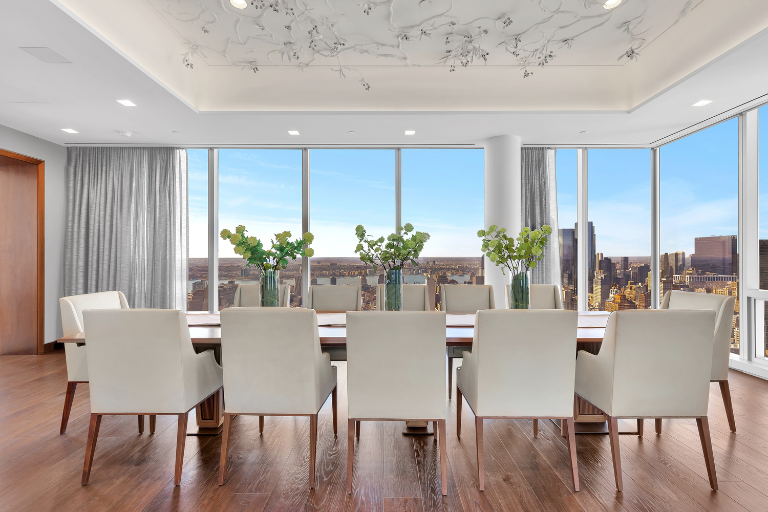 23 East 22nd Street, Unit PH Manhattan, NY 10010 - Photo 7 of 32 a view of a dining room with furniture window and wooden floor