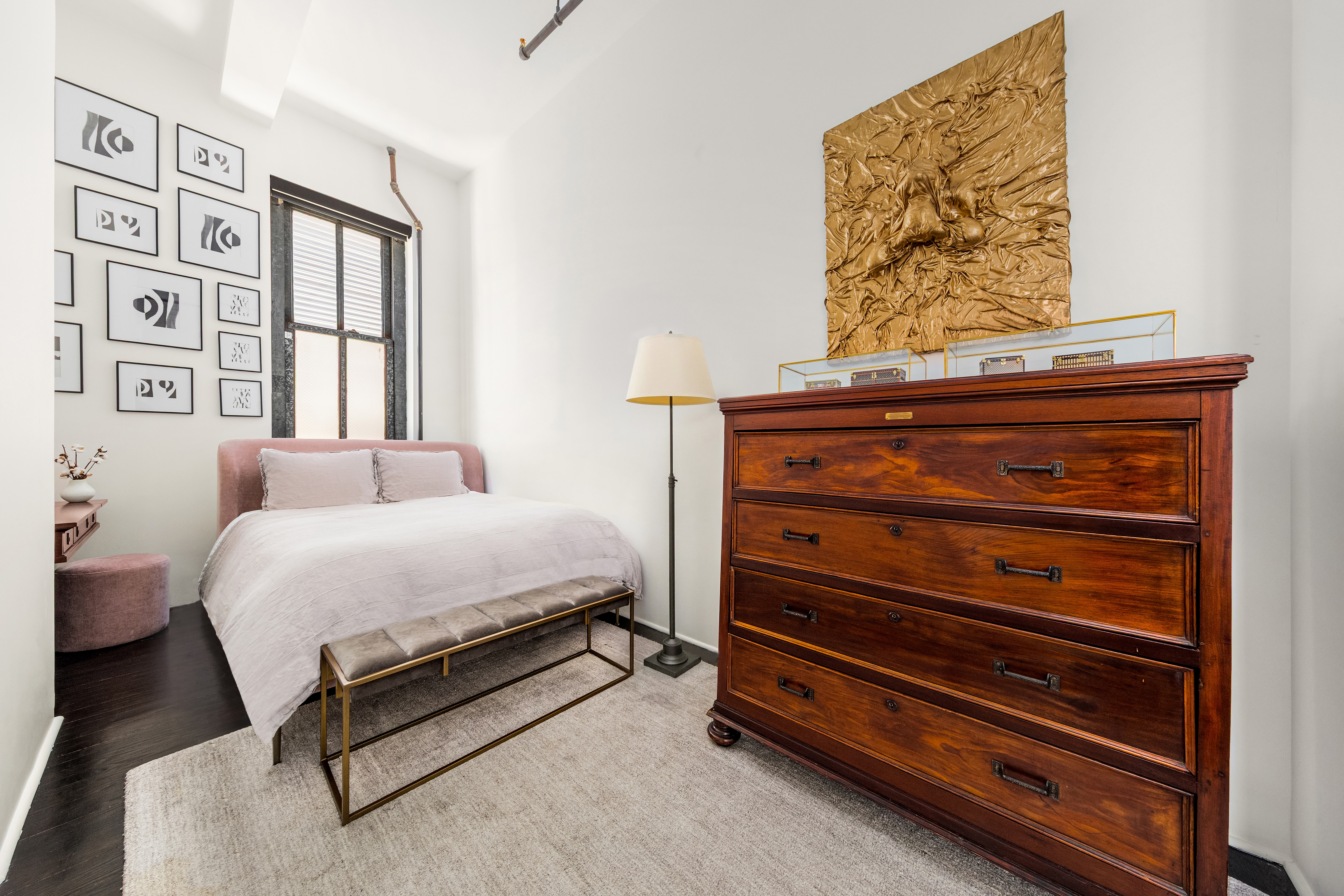 448 West 37th Street, Unit 11G/12G Manhattan, NY 10018 - Photo 13 of 17 a spacious bedroom with a bed and a window