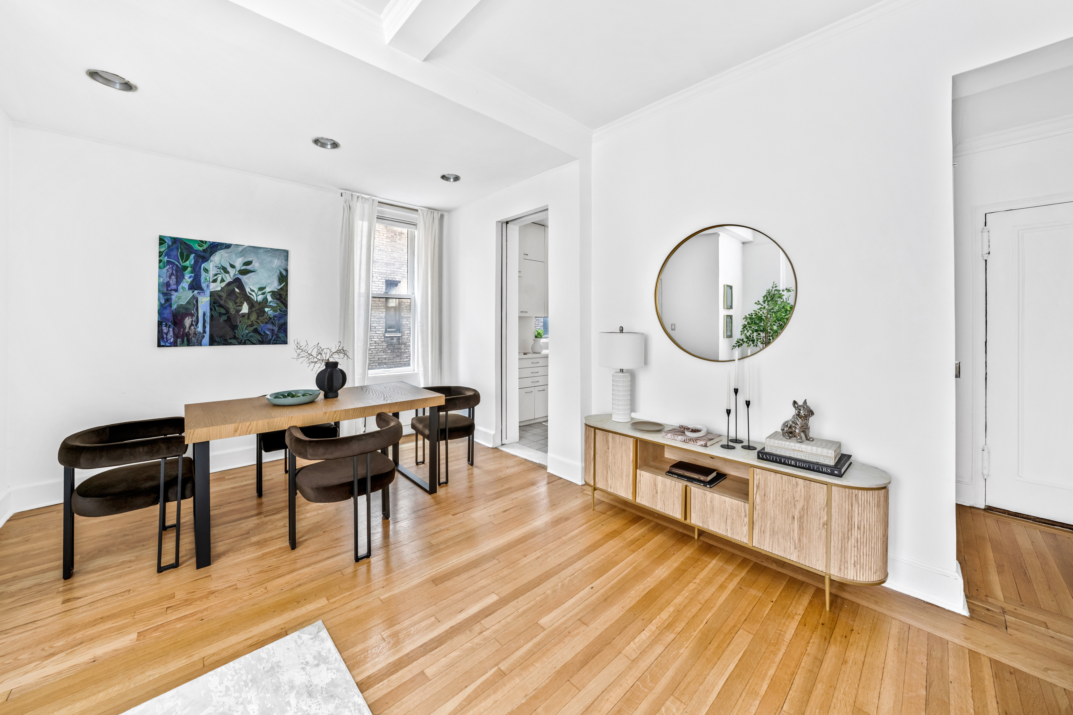 1060 Park Avenue, Unit 11A Manhattan, NY 10128 - Photo 3 of 11 a living room with furniture a piano and a wooden floor