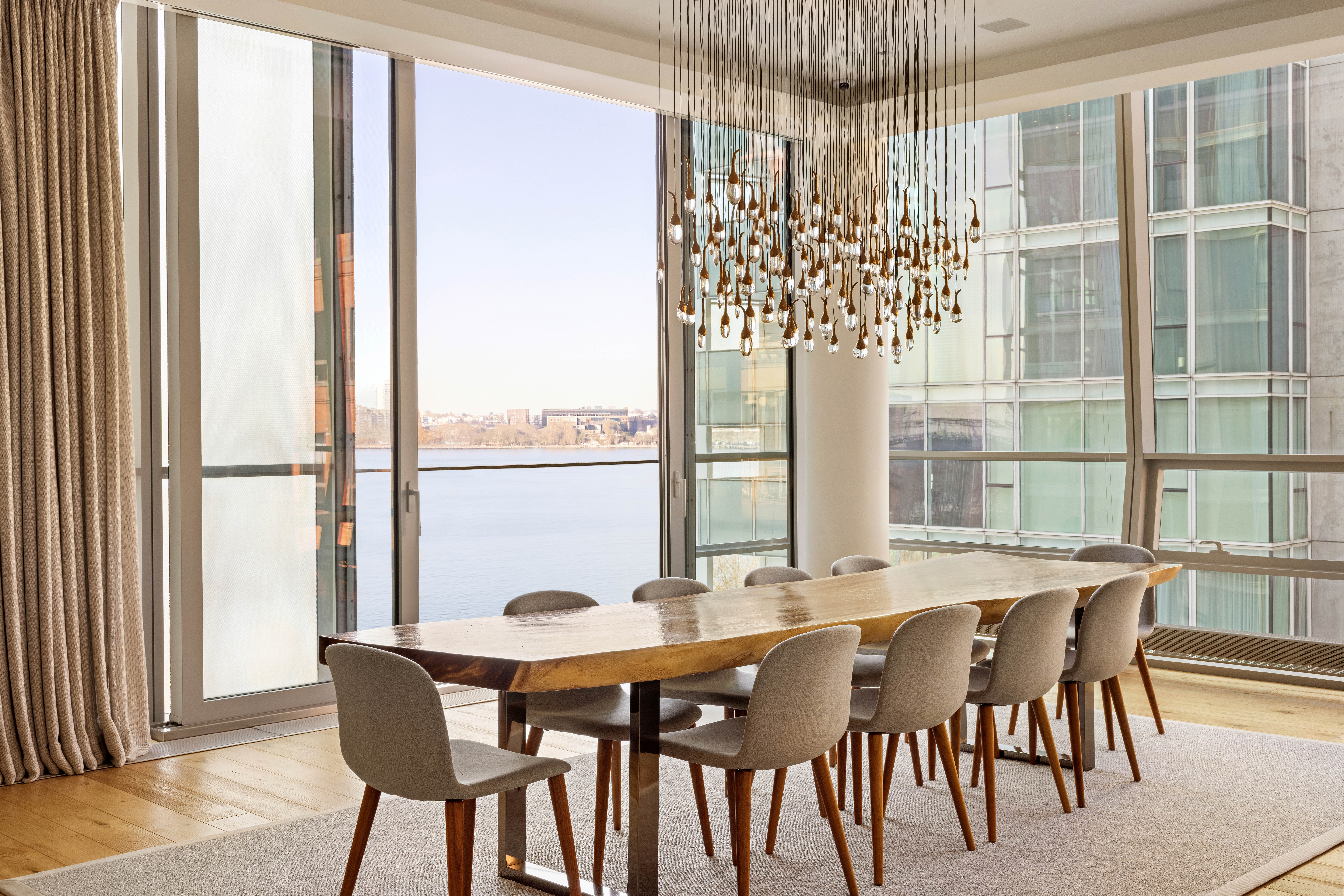 166 Perry Street, Unit 5A Manhattan, NY 10014 - Photo 6 of 25 a view of a dining room with furniture window and wooden floor
