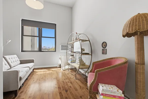 a living room with furniture and a large window