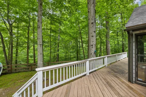 a view of a balcony with trees