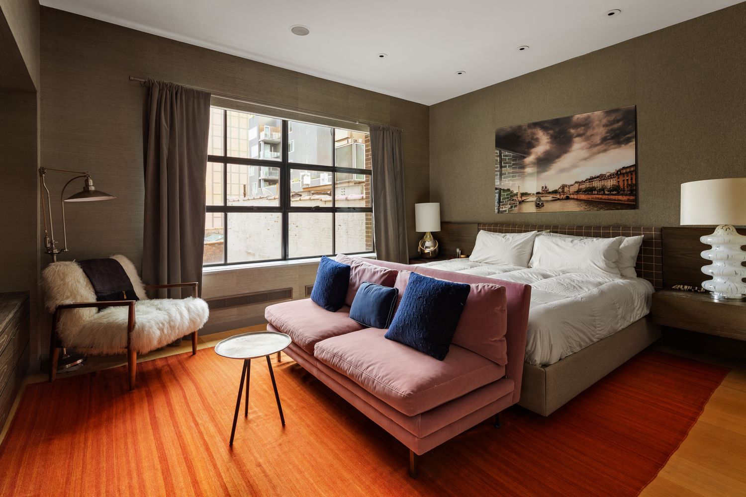 456 West 19th Street, Unit 6/7F Manhattan, NY 10011 - Photo 6 of 13 a bedroom with furniture and wooden floor