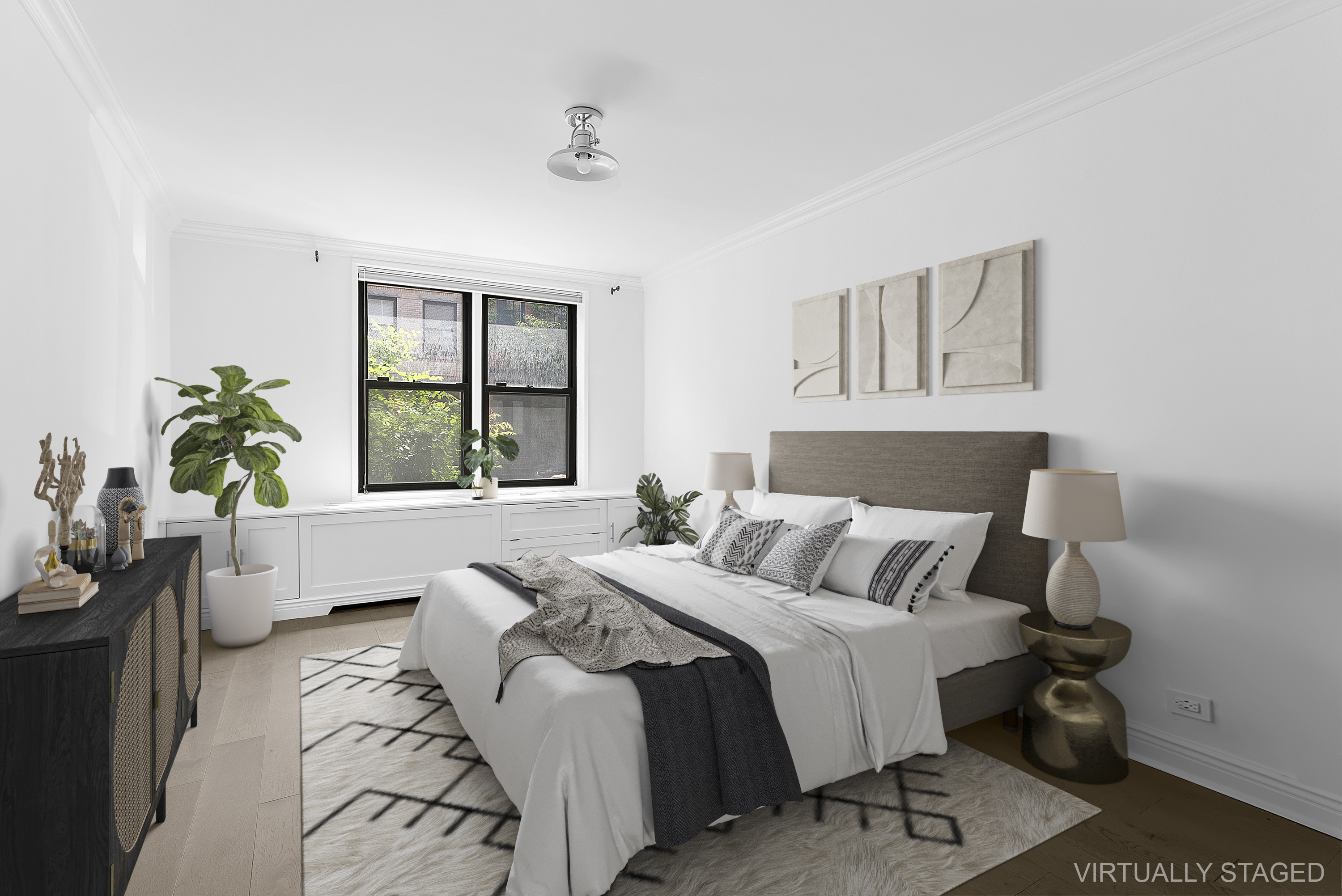 100 Bank Street, Unit 1H Manhattan, NY 10014 - Photo 8 of 10 a bedroom with a bed and a couch