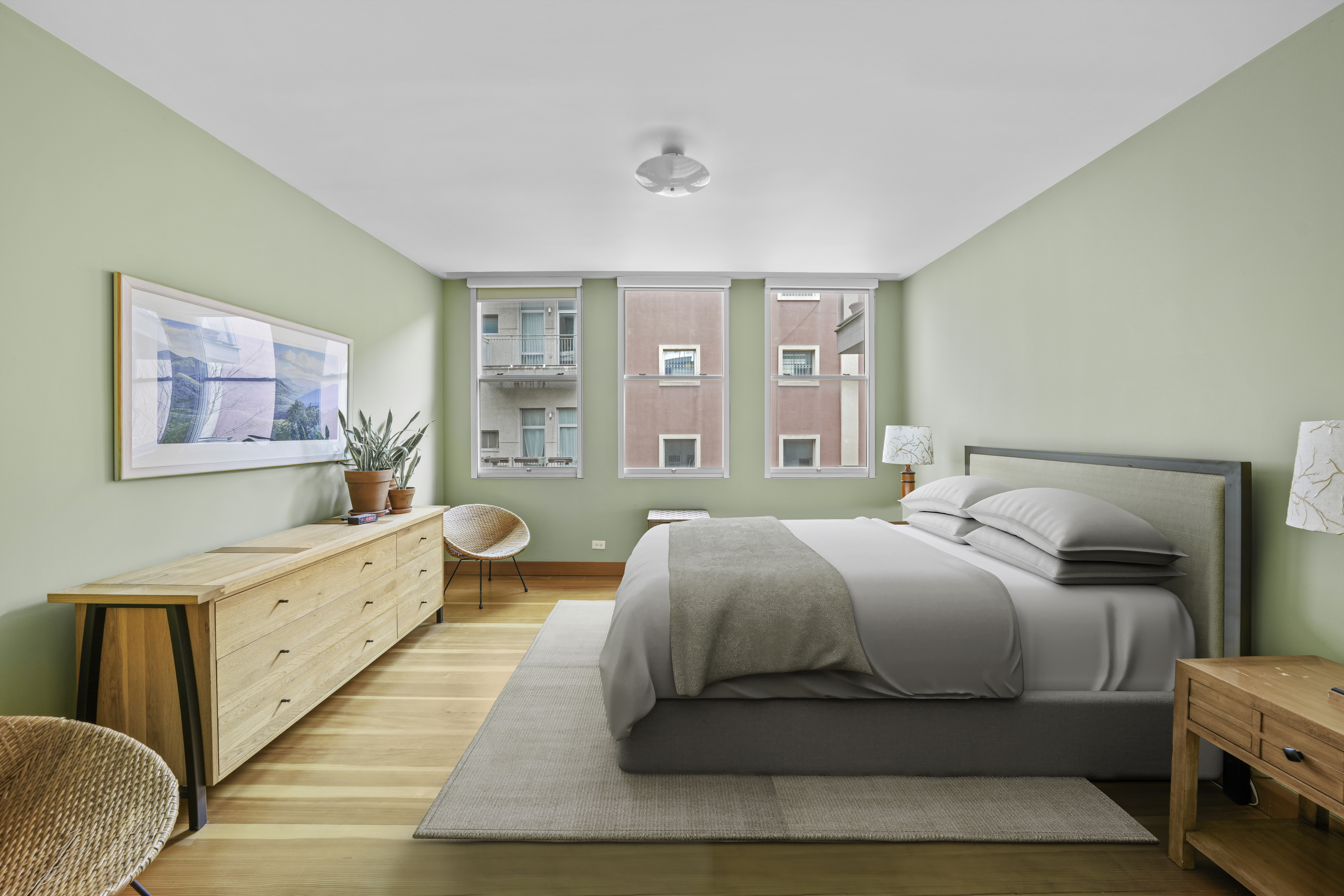 133 West 123rd Street Manhattan, NY 10027 - Photo 17 of 31 a spacious bedroom with a bed and wooden floor