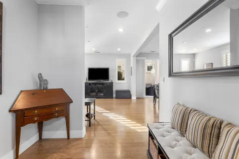 a bathroom with a toilet a sink and a mirror