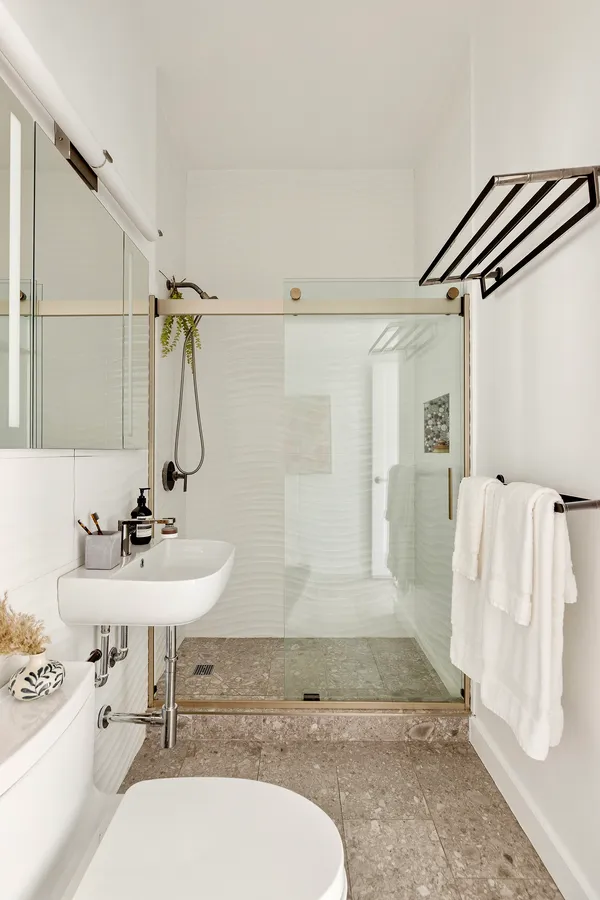 a bathroom with a sink mirror and a bathtub