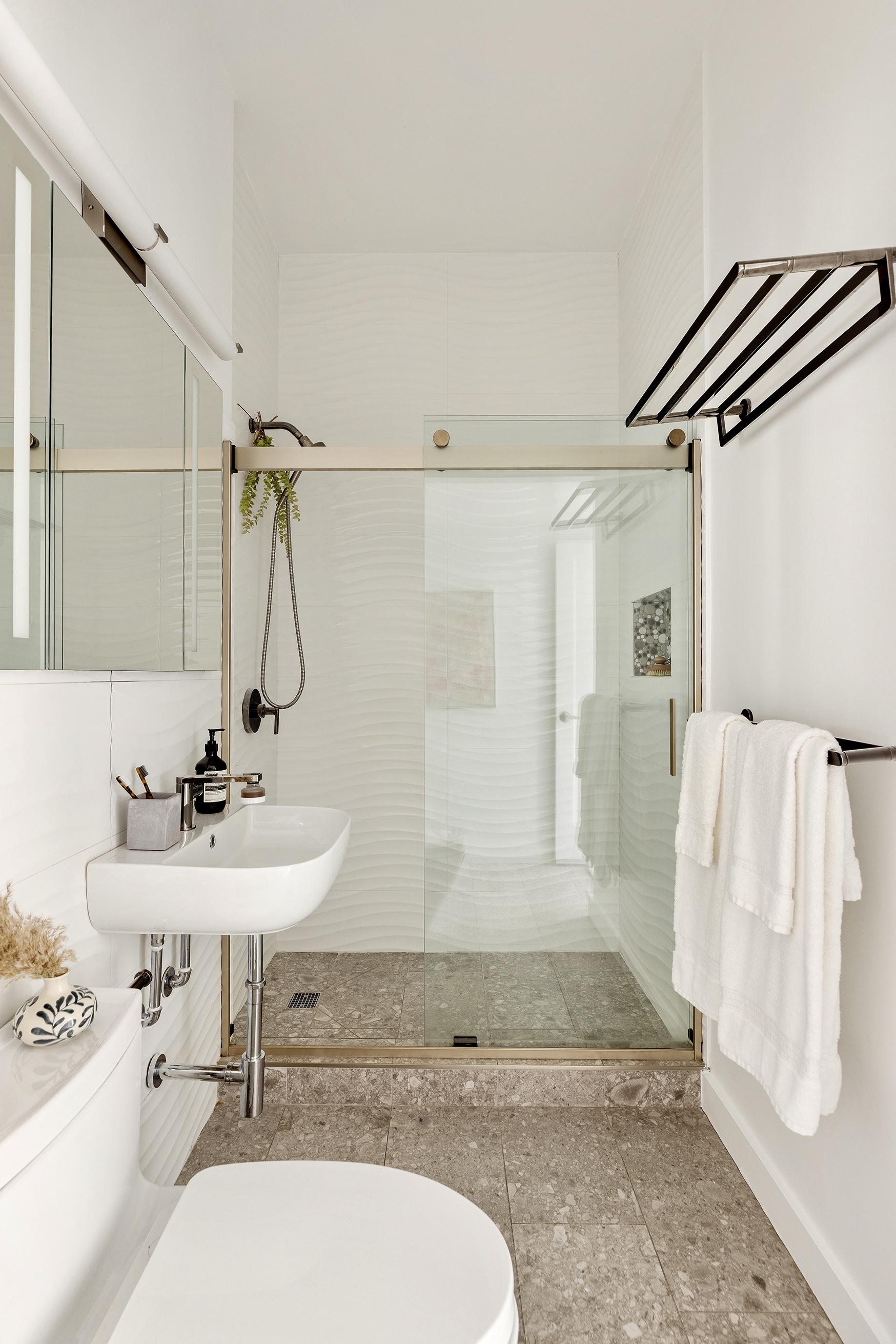 720 Greenwich Street, Unit 1F New York, NY 10014 - Photo 11 of 16 a bathroom with a sink mirror and a bathtub