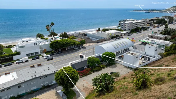 an aerial view of a house with outdoor space