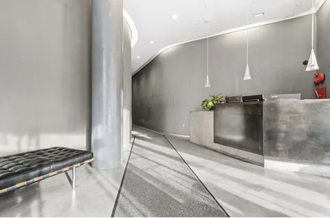 a kitchen with stainless steel appliances kitchen island granite countertop a refrigerator and a stove