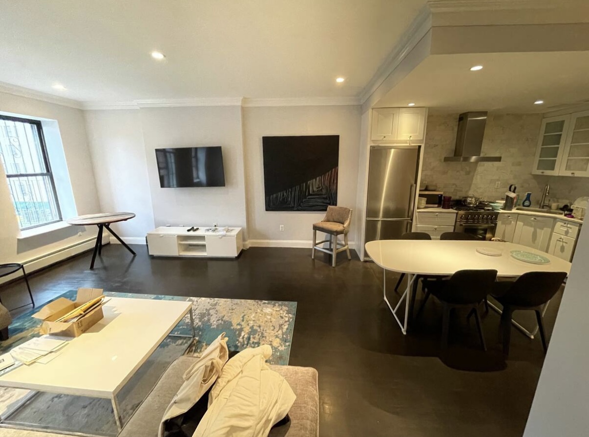 2073 Adam Clayton Powell Jr Boulevard, Unit 4 Manhattan, NY 10027 - Photo 4 of 10 a living room with dining room and wooden floor