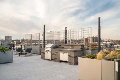 a view of a terrace with furniture and stove