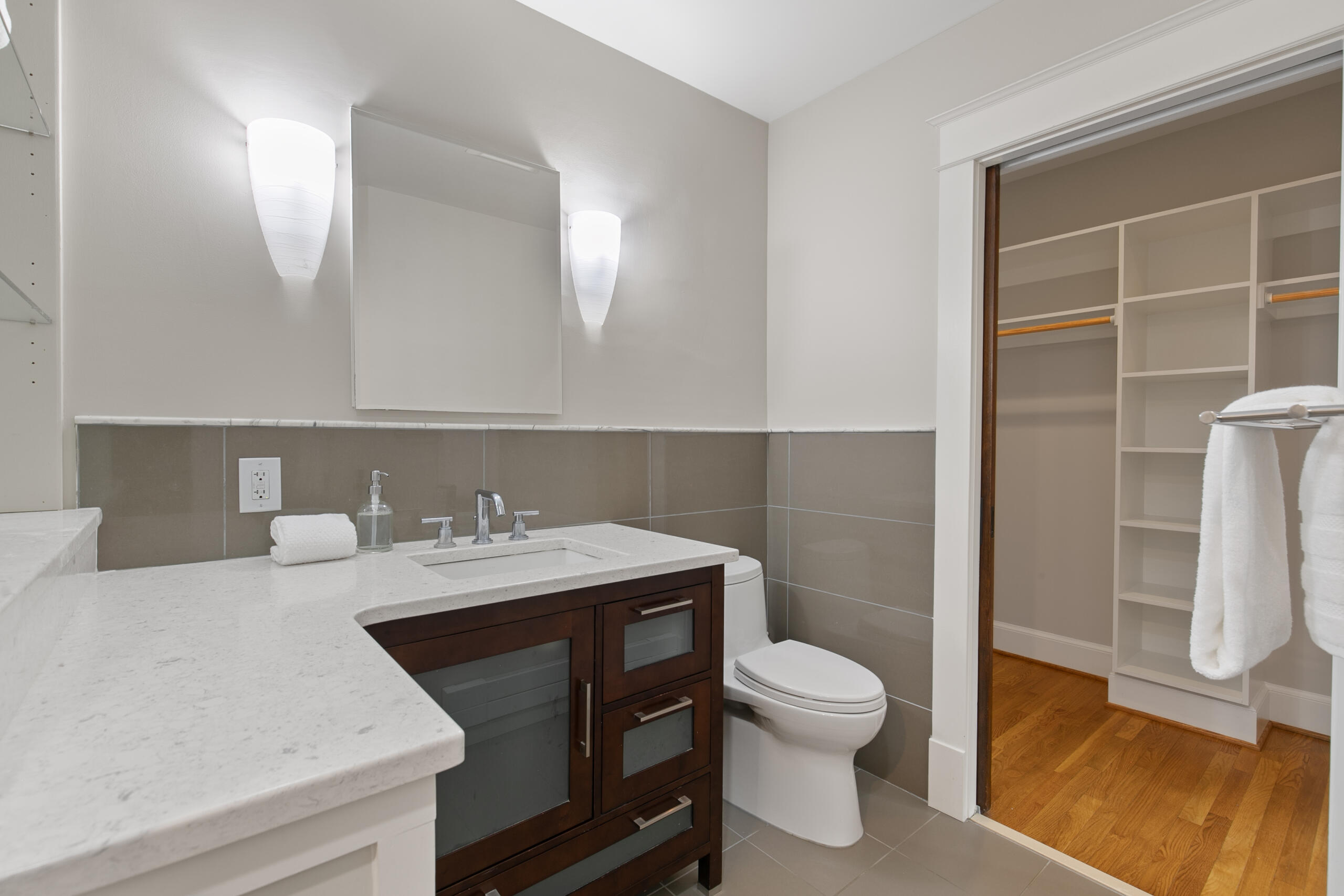 1908 Glen Ross Road Silver Spring, MD 20910 - Photo 30 of 63 a bathroom with a sink a toilet and a mirror