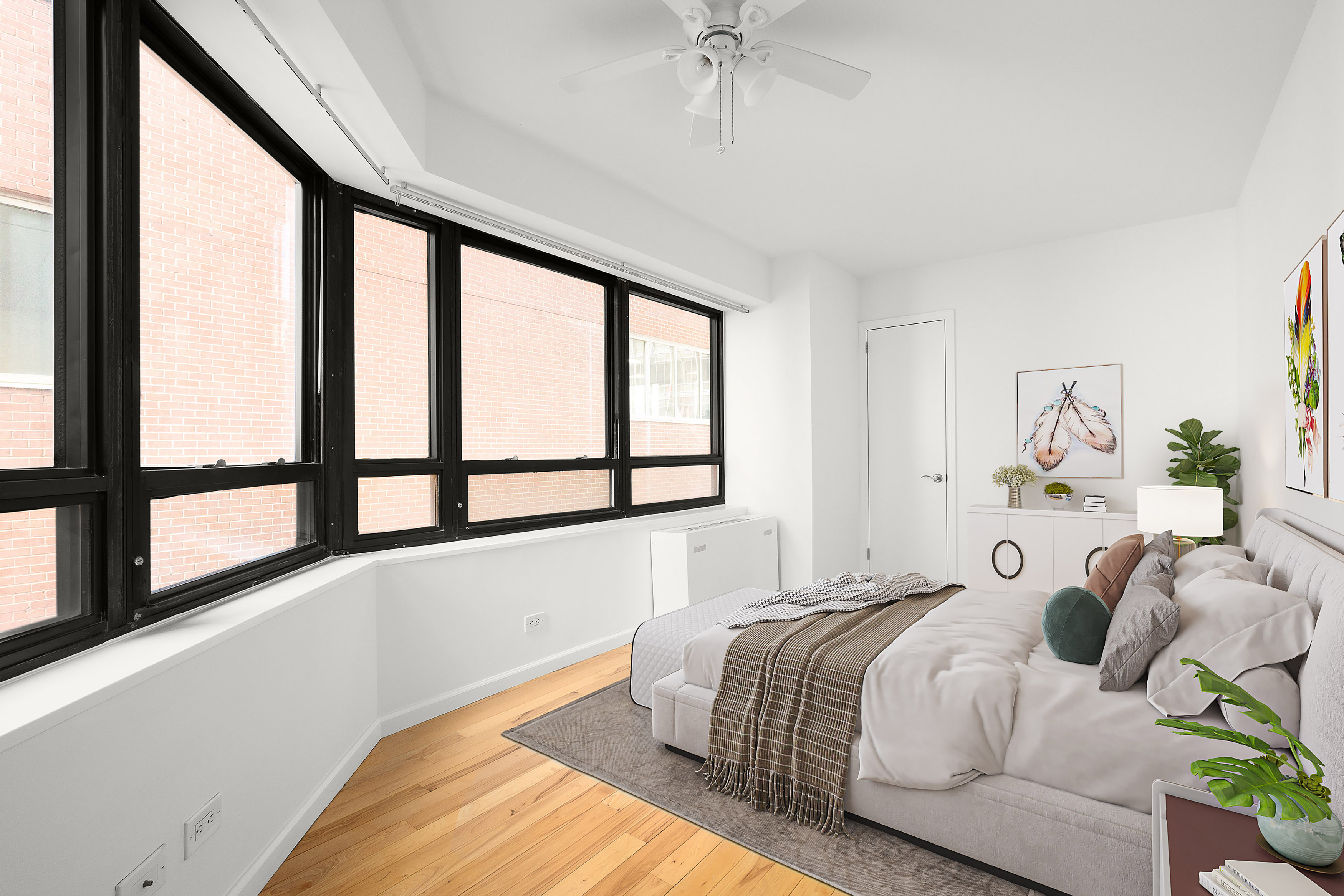 240 East 47th Street, Unit 4B Manhattan, NY 10017 - Photo 9 of 25 a bedroom with bed and a large window
