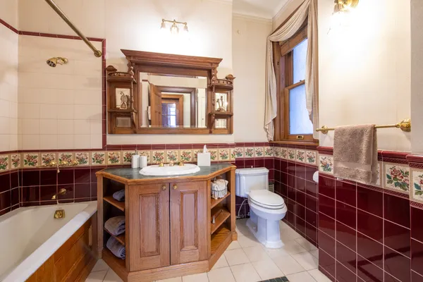 a bathroom with a sink a toilet and bathtub