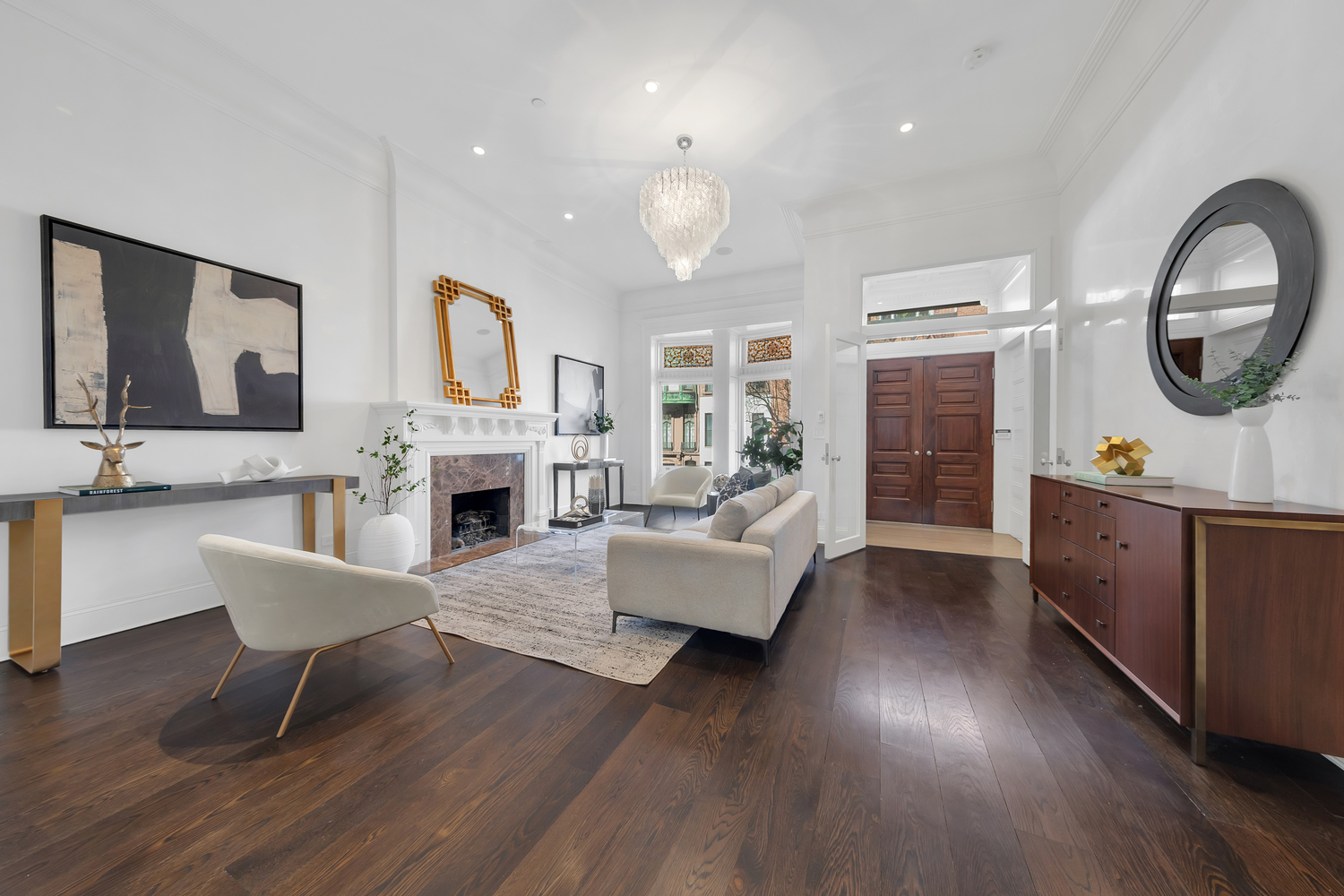 42 West 71st Street Manhattan, NY 10023 - Photo 5 of 35 a living room with furniture a fireplace and a large mirror