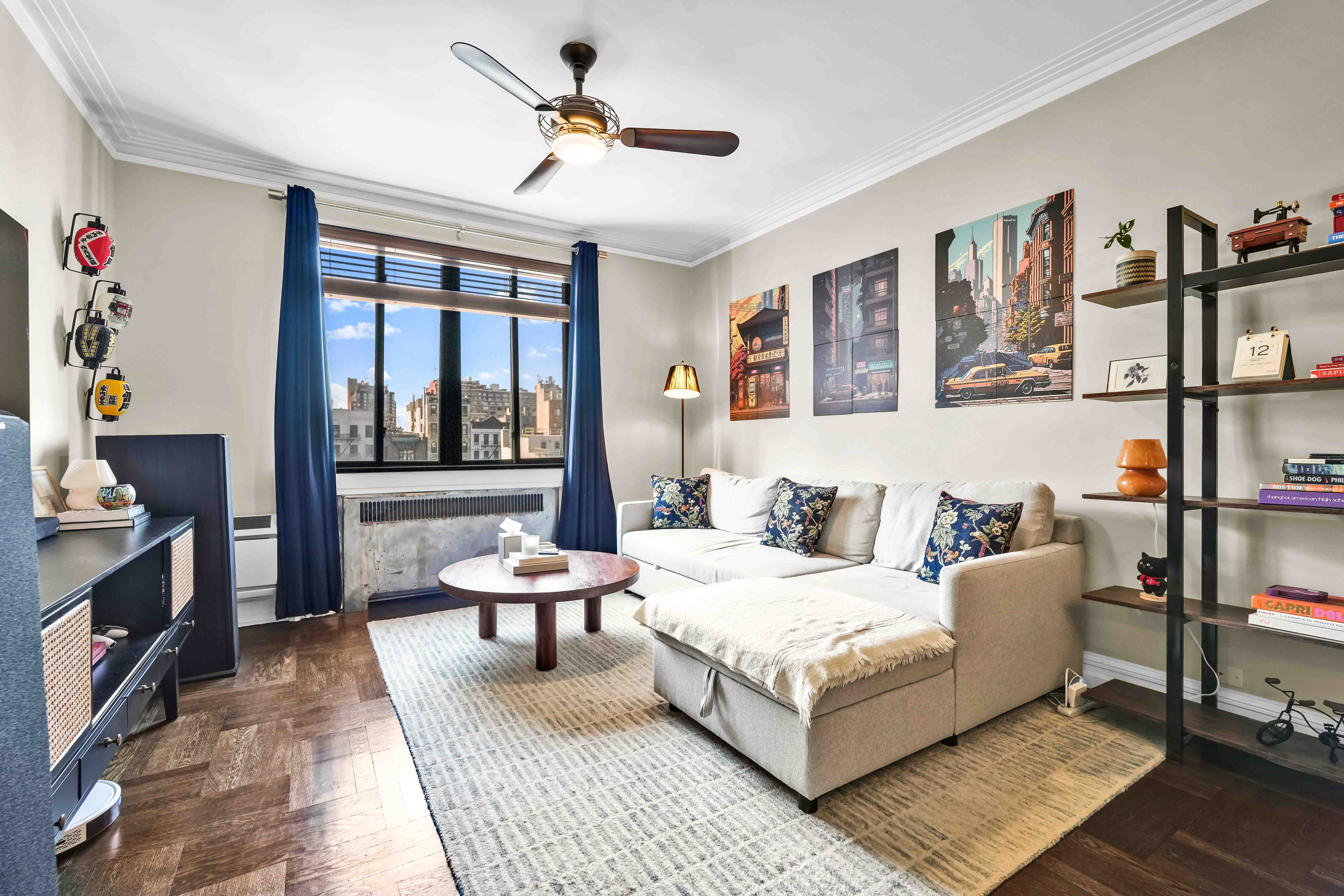 255 West 23rd Street, Unit 5GW Manhattan, NY 10011 - Photo 2 of 35 a living room with furniture and a window