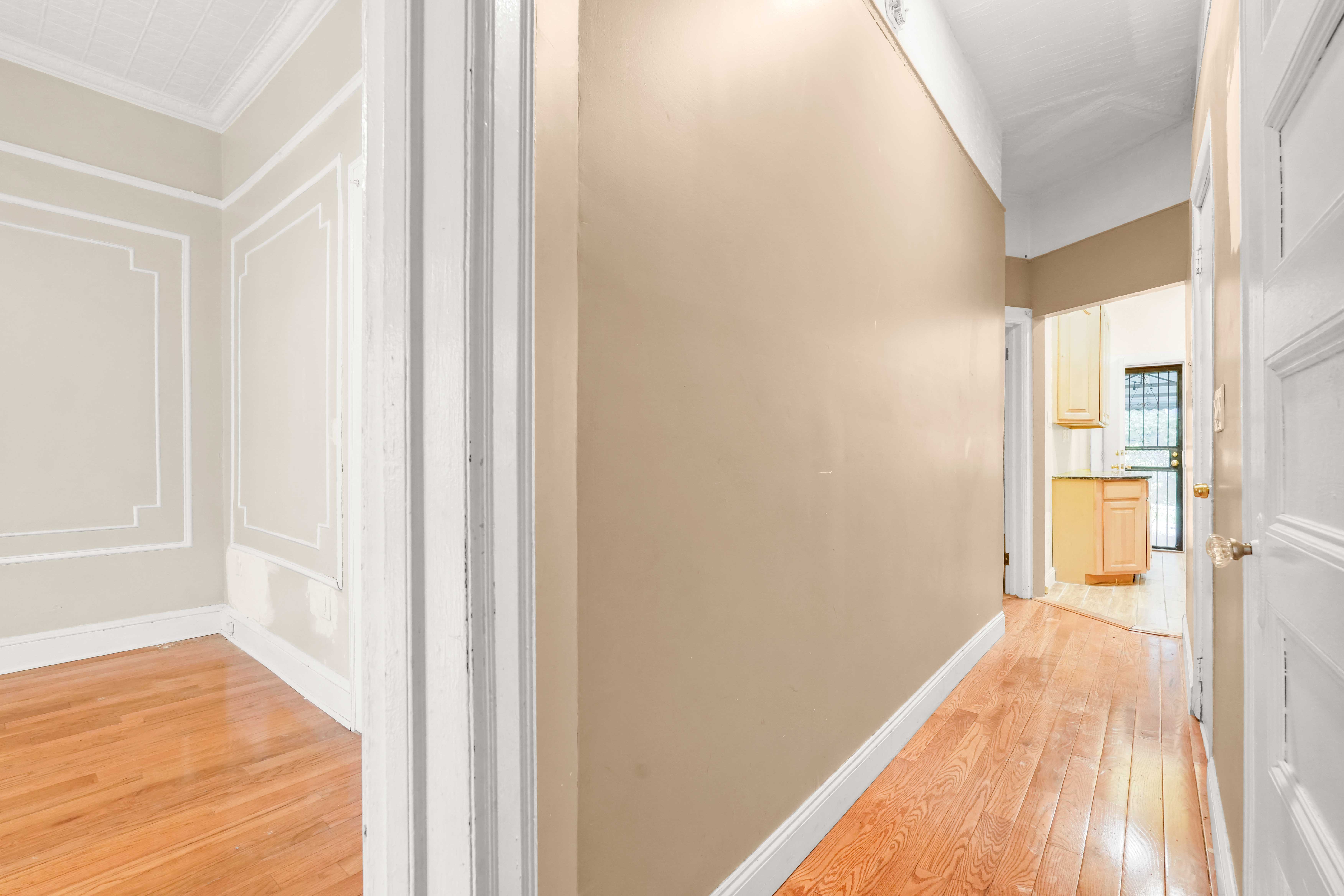278 Lefferts Avenue Brooklyn, NY 11225 - Photo 30 of 56 a view of a bedroom with wooden floor and a bathroom