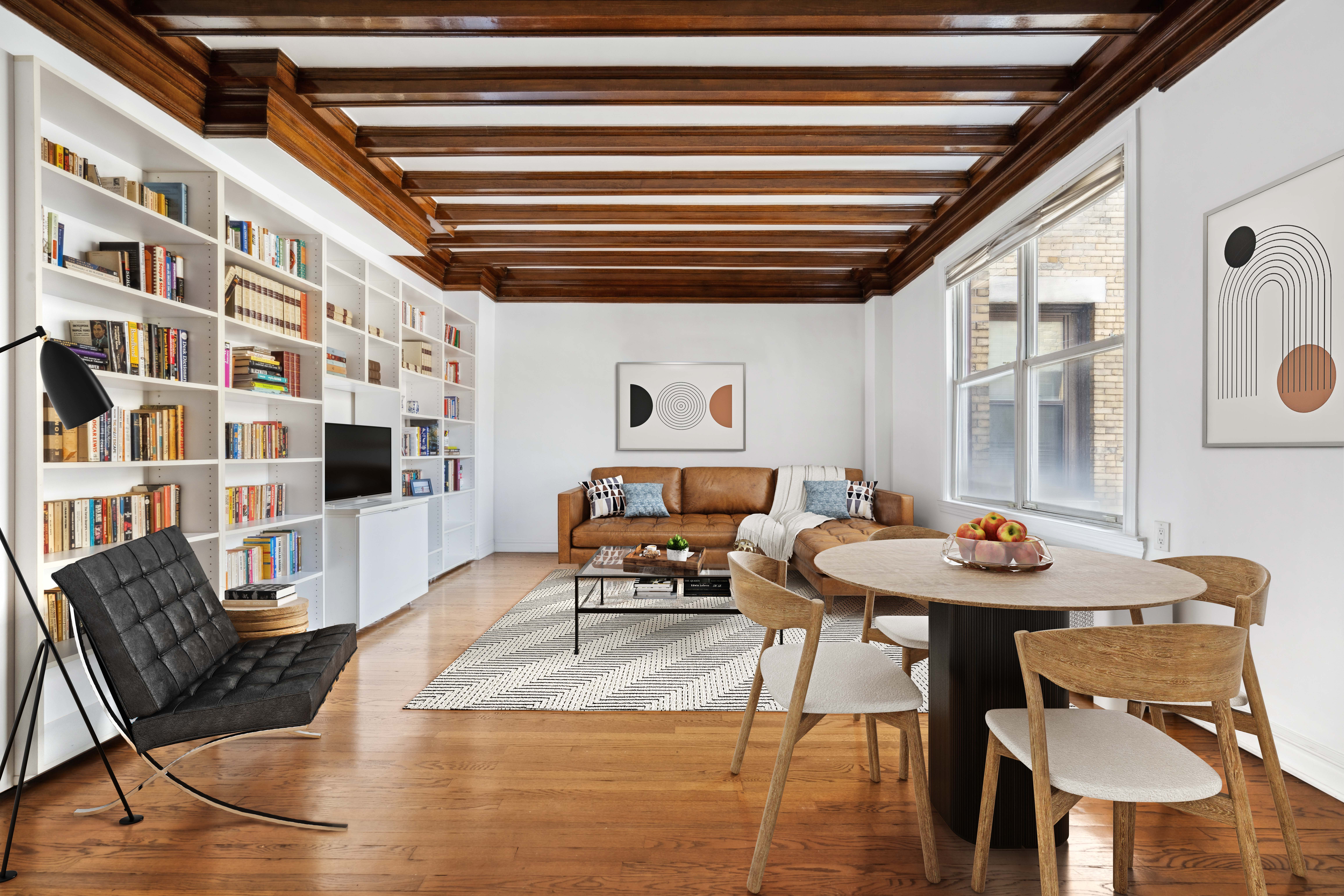 a living room with furniture and a potted plant
