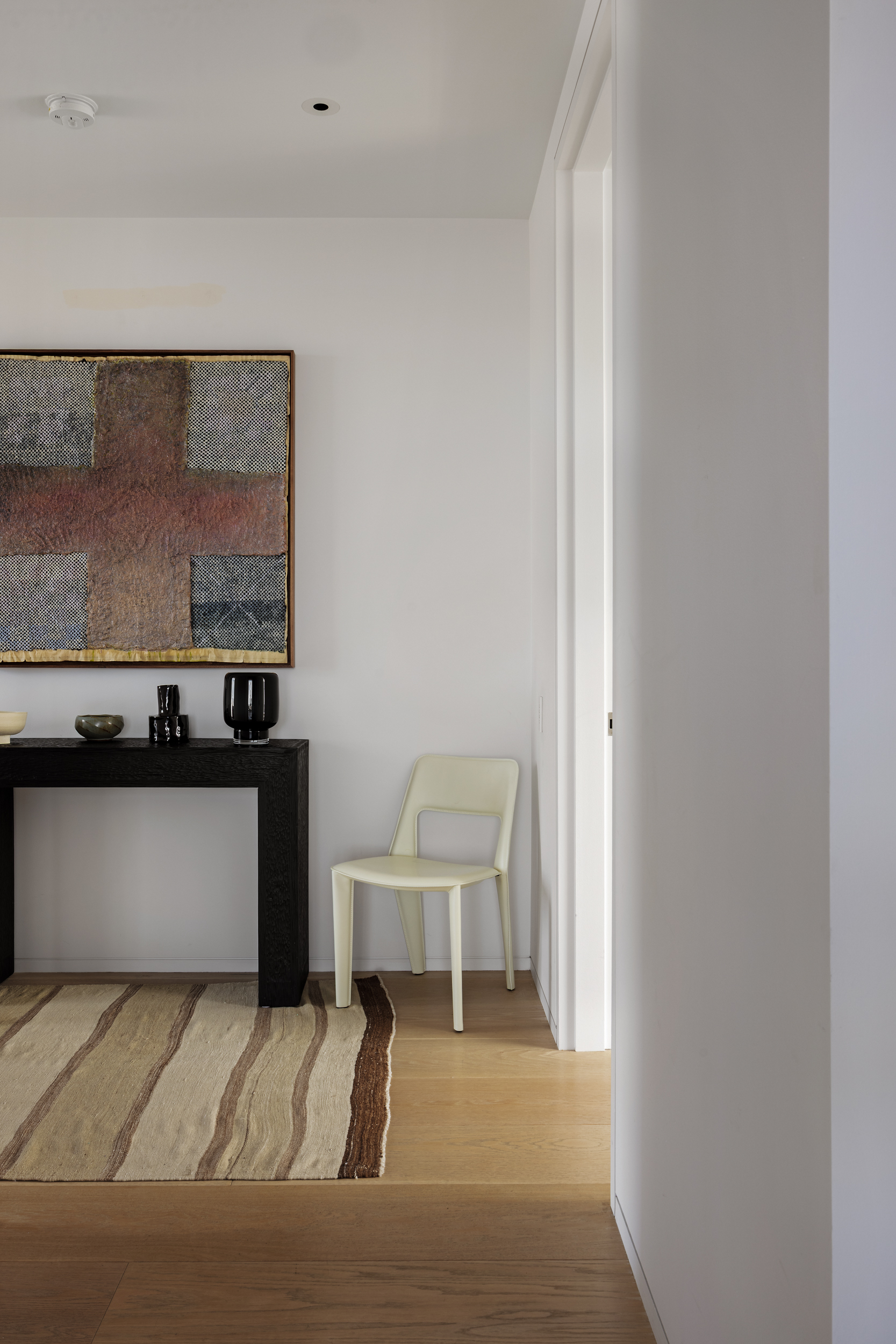 215 Chrystie Street, Unit 29W Manhattan, NY 10002 - Photo 21 of 24 a living room with a couch and chairs