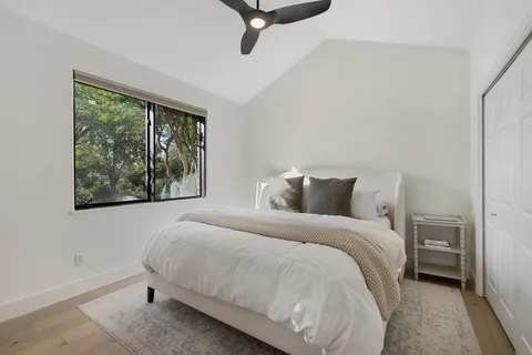 a bedroom with a bed and window