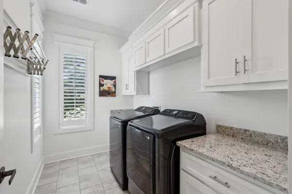 a roof deck with a table and chairs