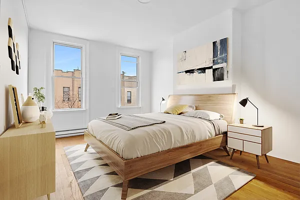 241 Himrod Street, Unit 3L Brooklyn, NY 11237 - Photo 3 of 5 a bedroom with a bed and wooden floor