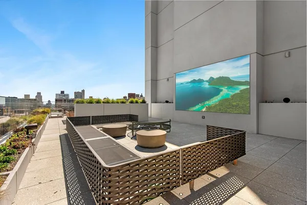 a view of a patio with table and chairs and potted plants