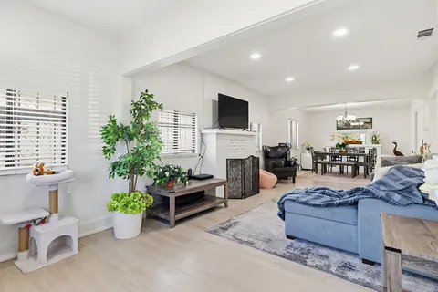 a living room with furniture or couch and a flat screen tv