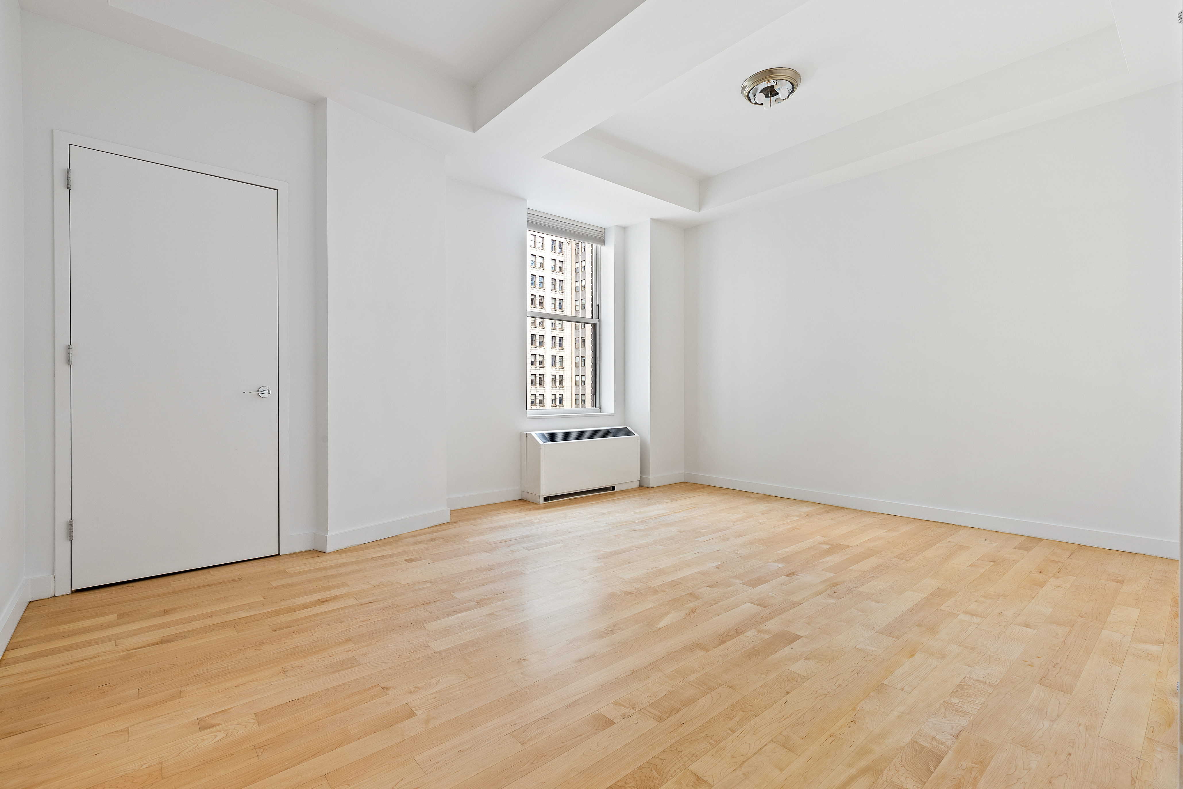 15 Broad Street, Unit 2000 Manhattan, NY 10005 - Photo 4 of 6 wooden floor in an empty room