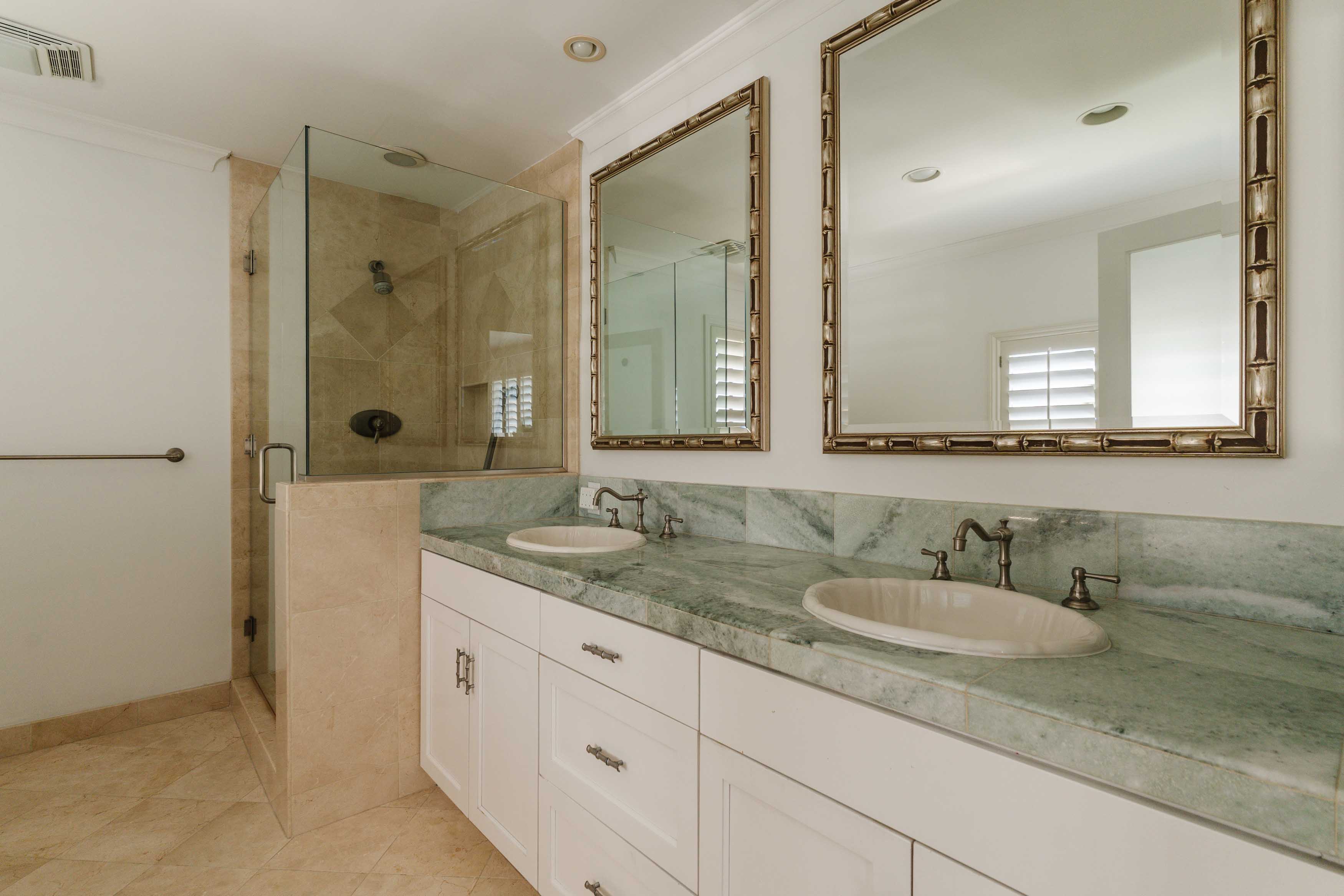 17273 Avenida De La Herradura Pacific Palisades, CA 90272 - Photo 18 of 23 a bathroom with a granite countertop sink and a mirror