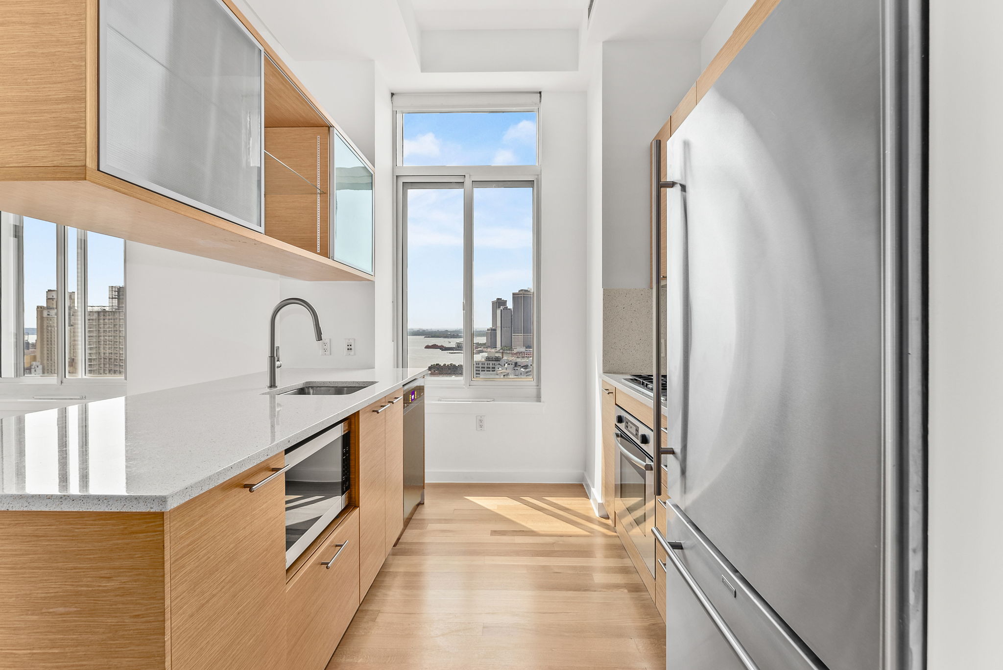 85 Adams Street, Unit 21A Brooklyn, NY 11201 - Photo 2 of 18 a bathroom with a sink and a mirror