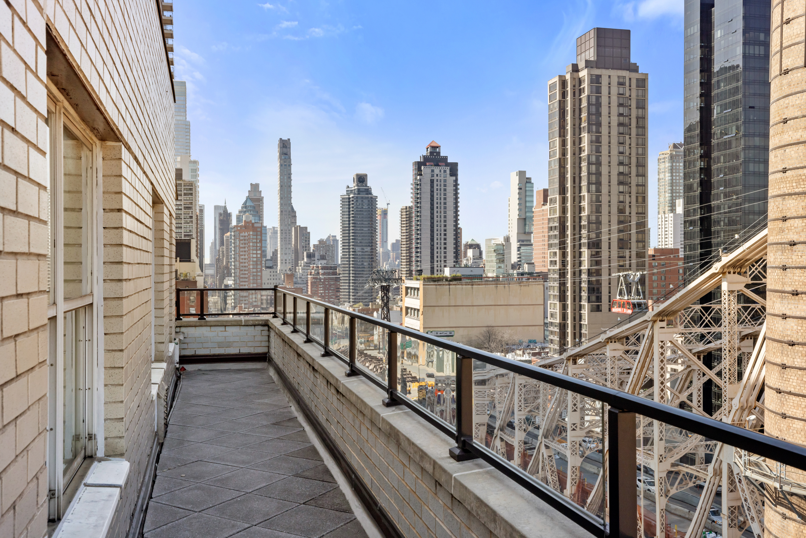 35 Sutton Place, Unit PHB Manhattan, NY 10022 - Photo 9 of 14 a view of city from a balcony