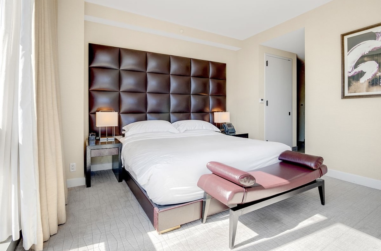 246 Spring Street, Unit 3503 Manhattan, NY 10013 - Photo 5 of 13 a bedroom with a bed and a window