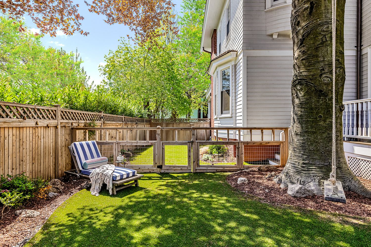 a view of a bench in front of house