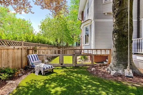 a view of a bench in front of house