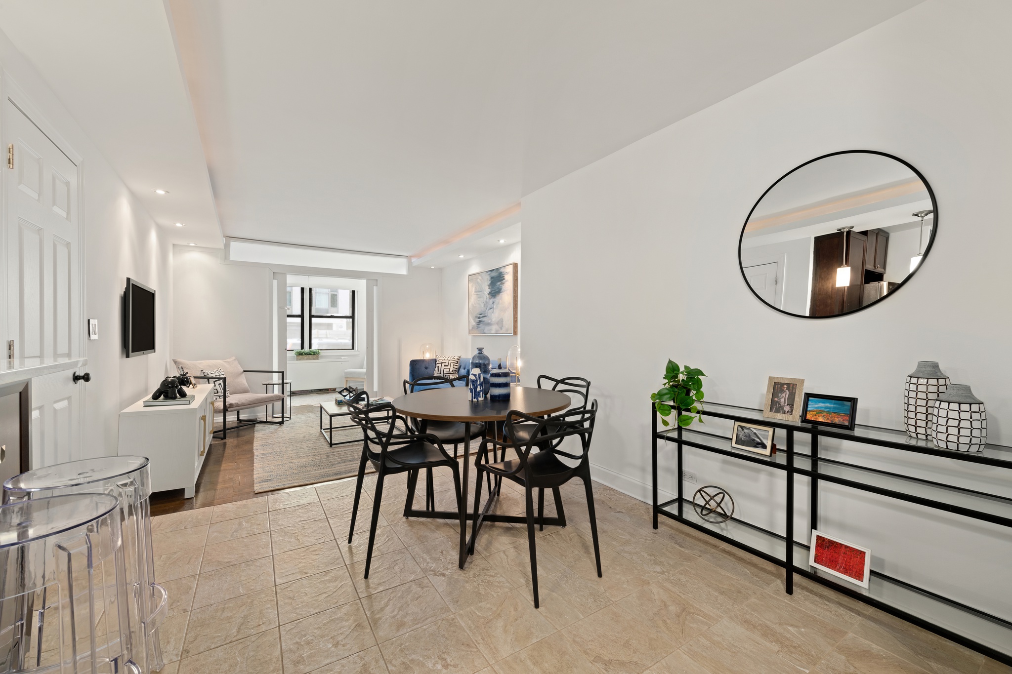 201 East 21st Street, Unit 1A Manhattan, NY 10010 - Photo 4 of 10 a view of a dining room with furniture and a rug