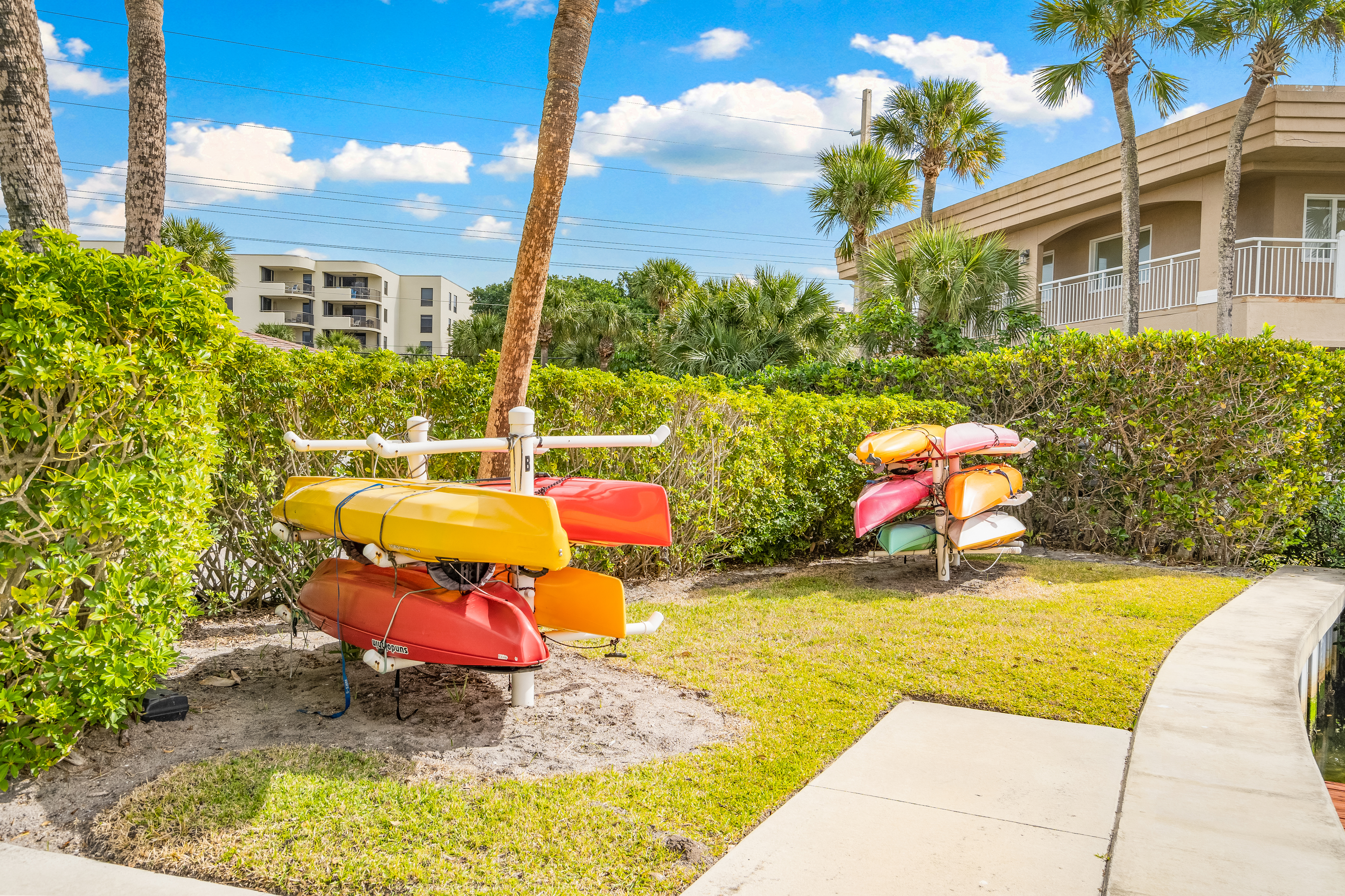 4601 Highway A1a, Unit 102 Vero Beach, FL 32963 - Photo 21 of 29 a view of a swimming pool with a lounge chairs