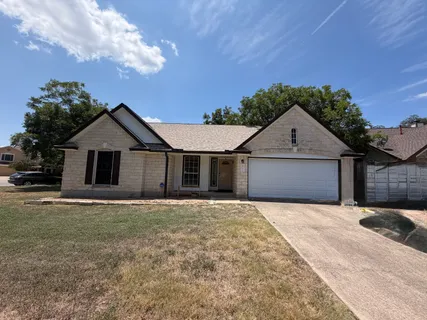 a front view of a house with yard