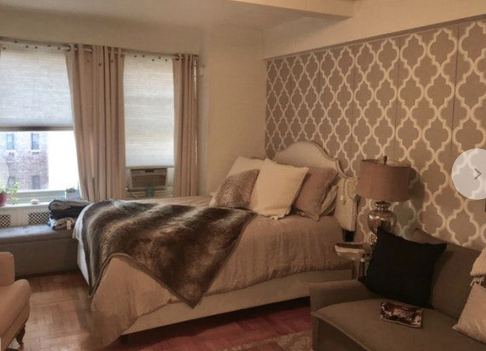 433 West 34th Street, Unit 6H Manhattan, NY 10001 - Photo 1 of 8 a bedroom with a bed and a window