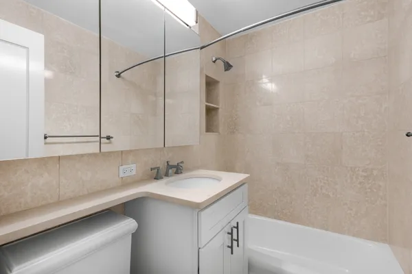 a bathroom with a sink and a bathtub