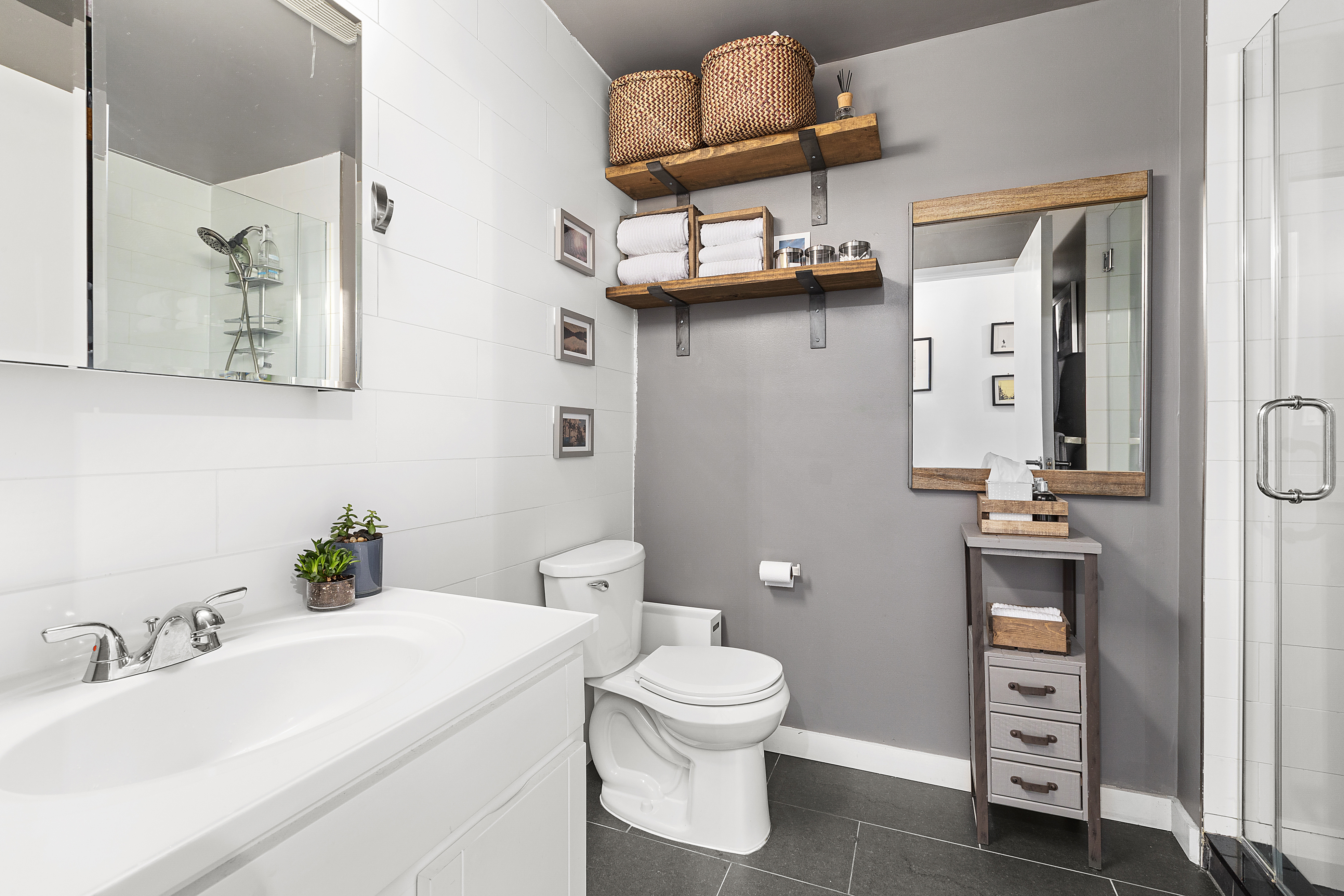 362 West 127th Street, Unit 5A Manhattan, NY 10027 - Photo 7 of 10 a bathroom with a sink a toilet and mirror