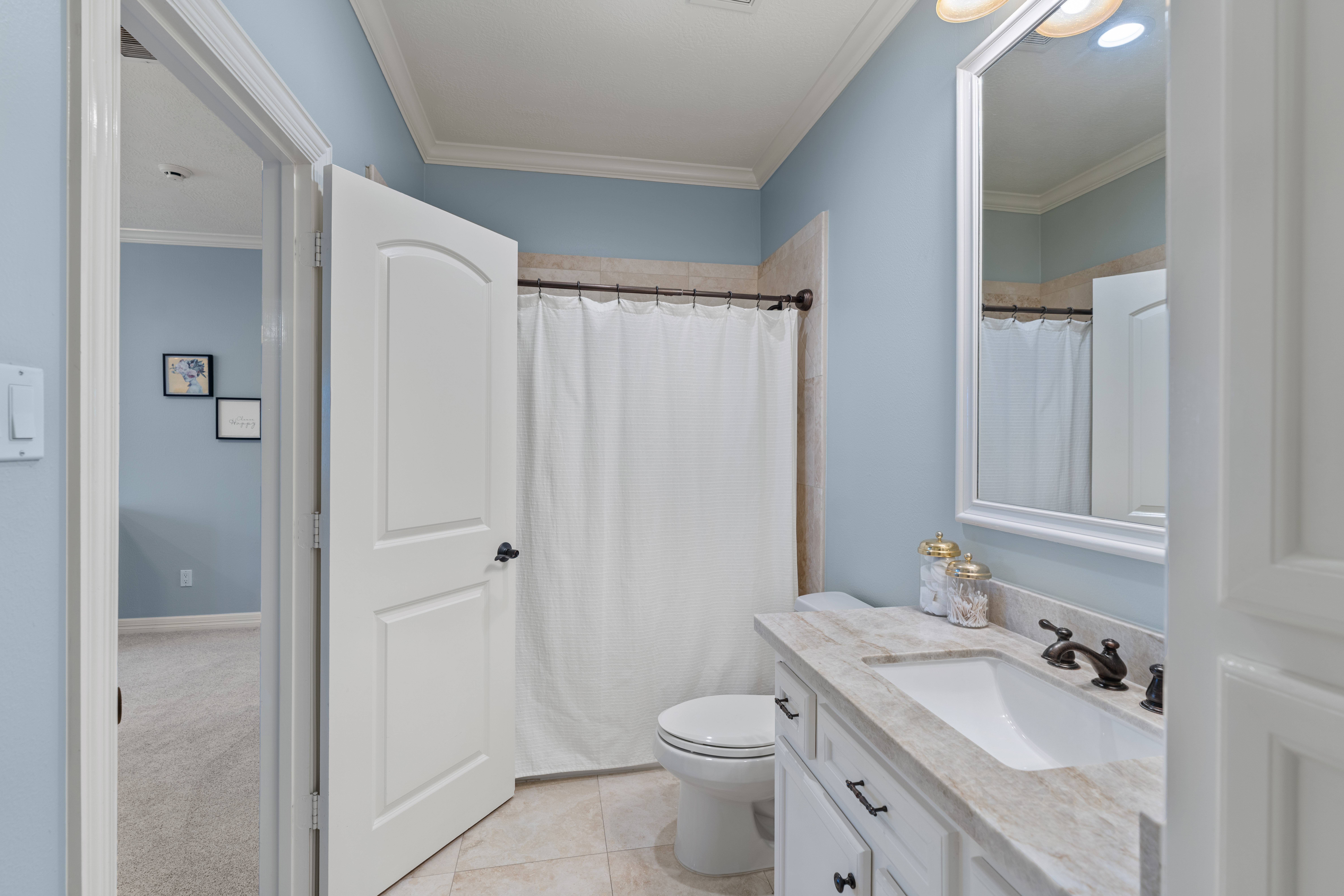 82 Manor Lake Estates Circle Spring, TX 77379 - Photo 37 of 52 a bathroom with a sink a toilet and shower