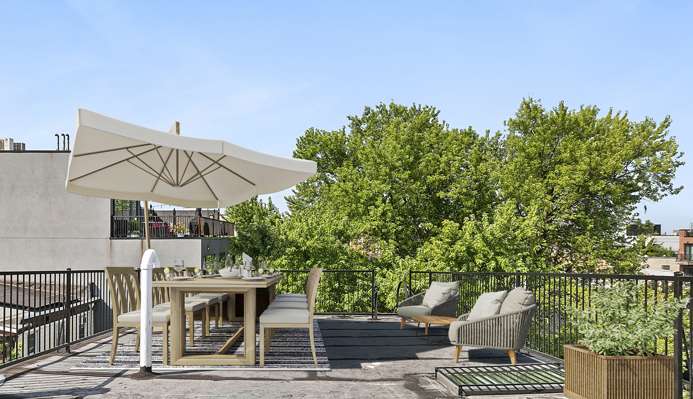 866 Bushwick Avenue, Unit 3 Brooklyn, NY 11221 - Photo 12 of 13 a view of a patio with a table and chairs under an umbrella
