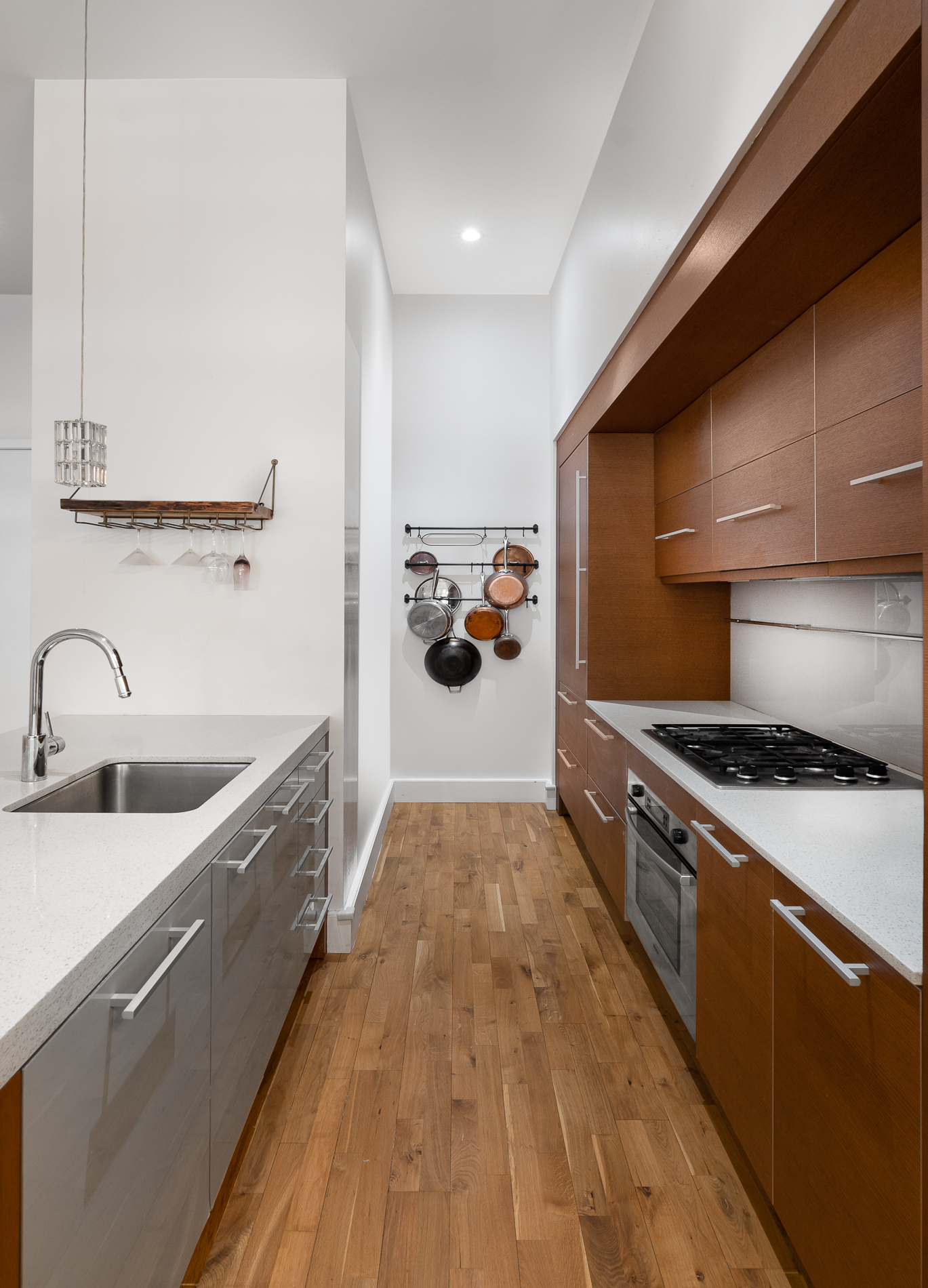 360 Furman Street, Unit 701 Brooklyn, NY 11201 - Photo 5 of 14 a kitchen with stainless steel appliances granite countertop a sink stove and refrigerator